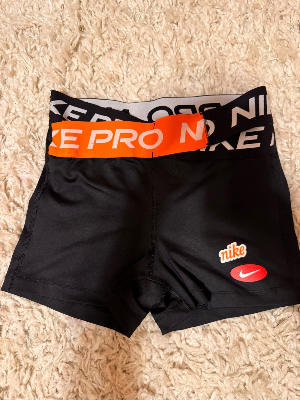 Nike Kids Black Leggings with Orange Waistband and Red Logo
